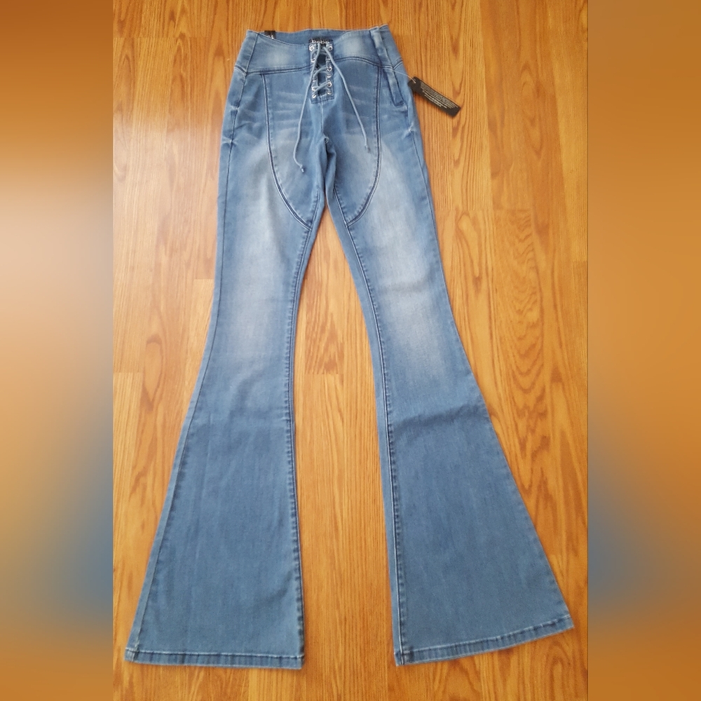 Bebe Lace Up Mid Rise Flare Jeans